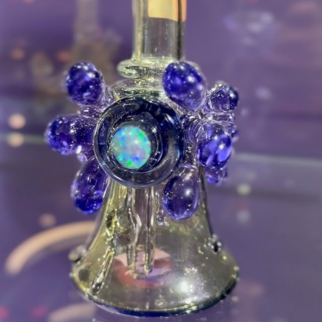 A hand-blown Purple Co. glass rig with an opal &lsquo;third eye&rsquo; and violet accents