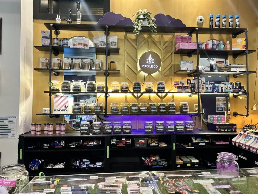 Inside Purple Co. — Congress Street, Portland: the gold jar wall behind the counter