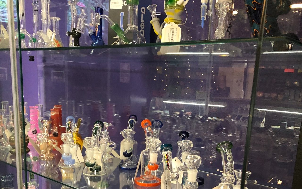 Inside Purple Co. — Lewiston: a display case of hand-blown glass